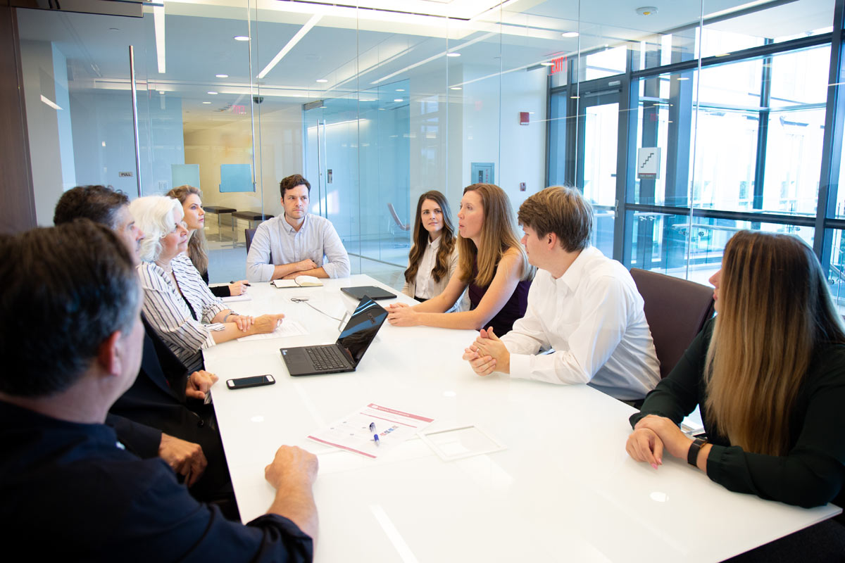 photo of staff in a round table meeting