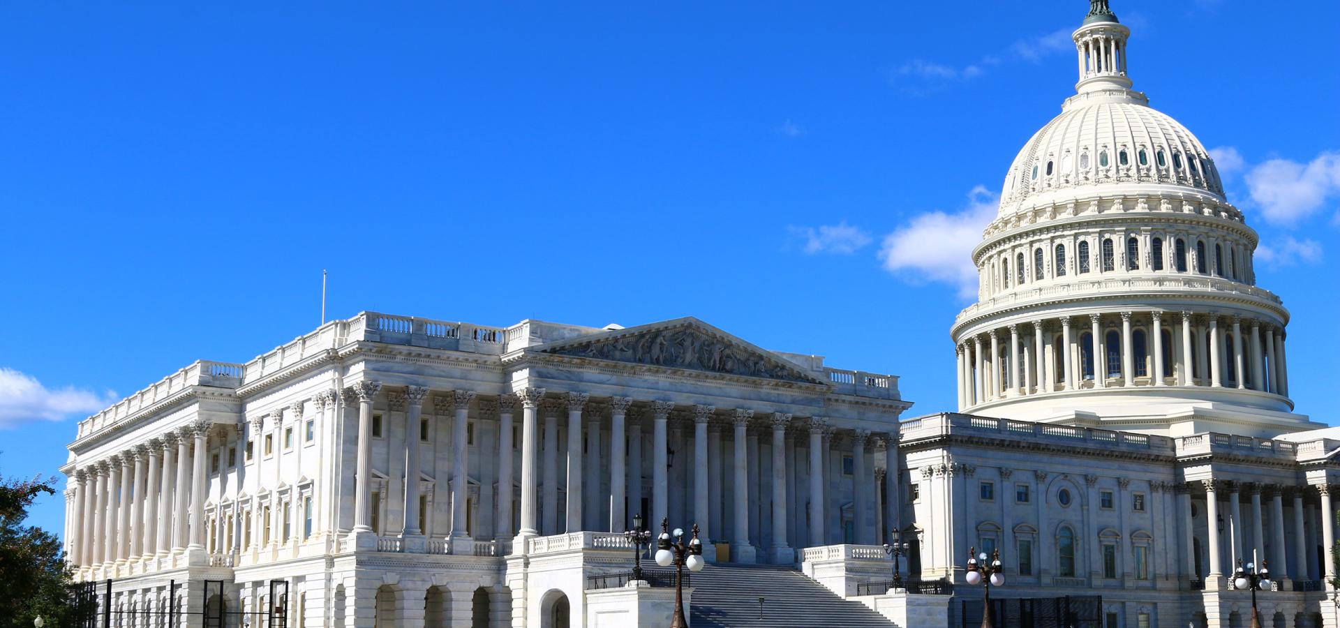 Capitol dome against blue sky