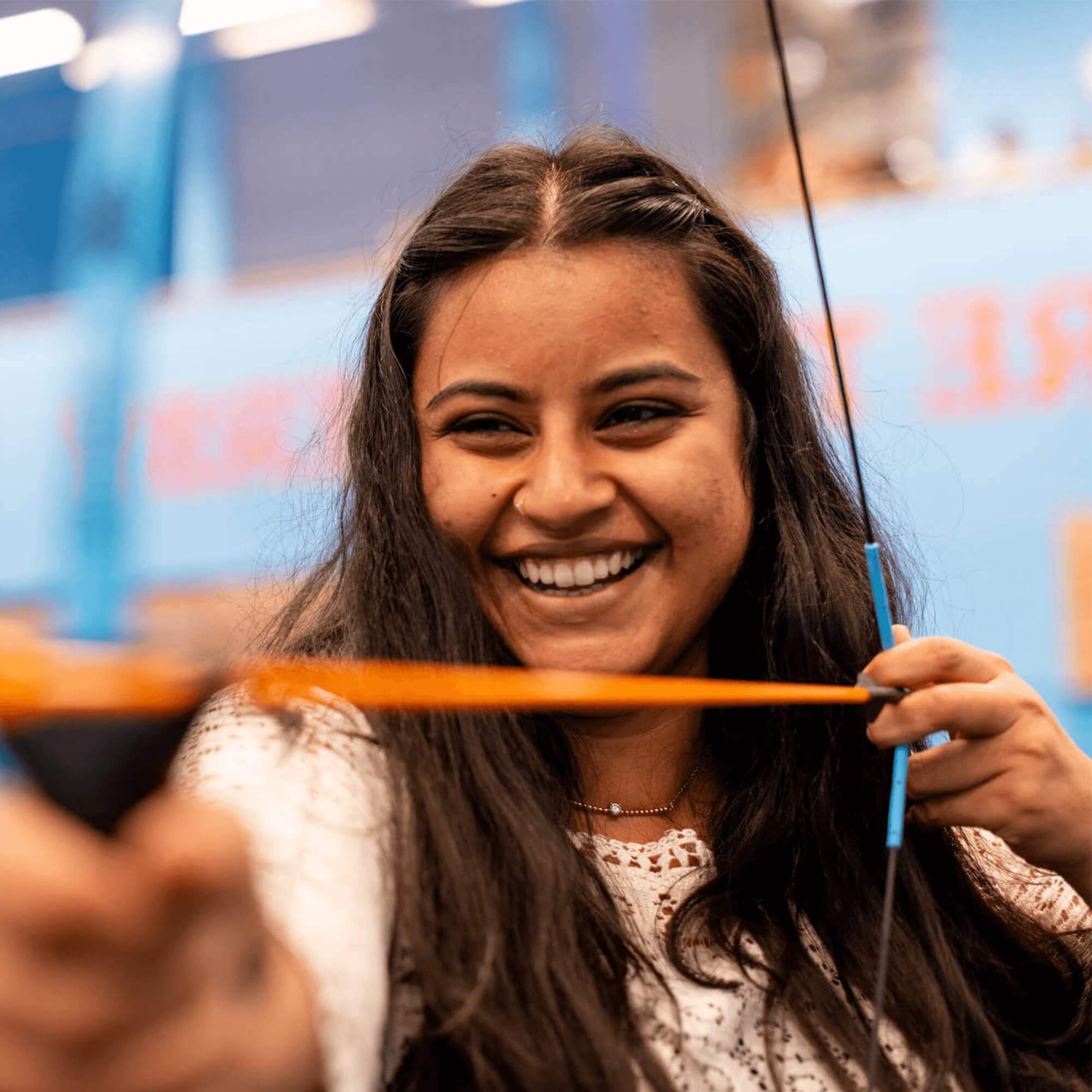 A young international student from India having a go at archery