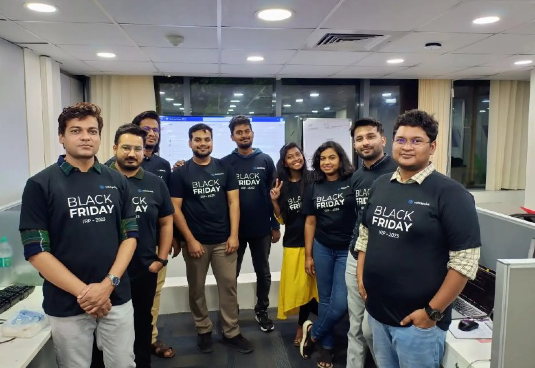 a group of people standing in a room