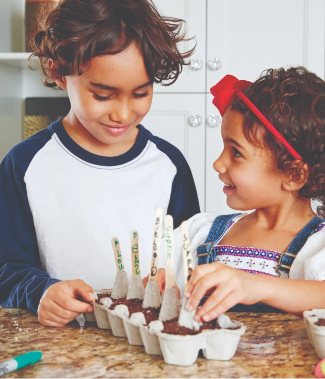 Children making a homemade planter out of egg cartons for Today's Parent Magazine