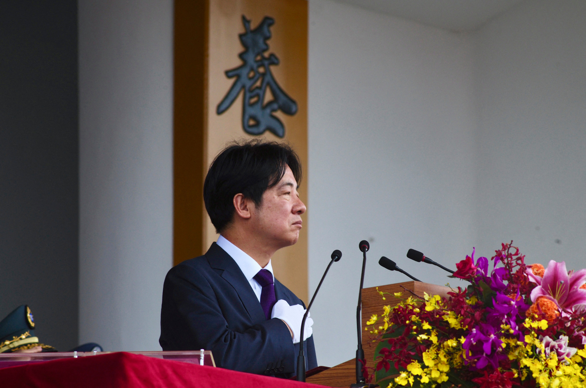 Taiwan President Lai Ching-te gestures at the Republic of China (ROC) Military Academy during the academy's 100th anniversary ceremony in Kaohsiung on June 16, 2024. (Photo by Sam Yeh / AFP)