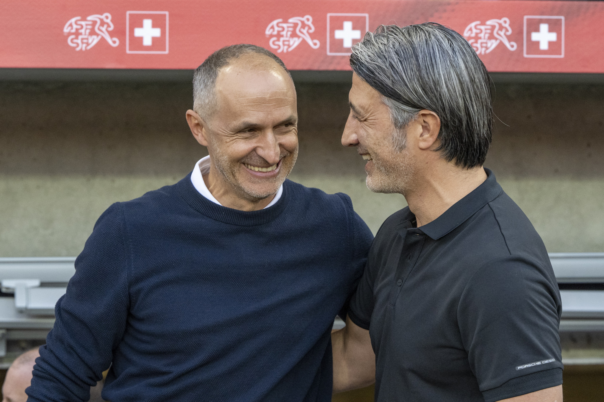 epa11389912 Head coach Murat Yakin (R) of Switzerland and head coach Thomas Haeberli (L) of Estonia during the international friendly soccer match between Switzerland and Estonia, in Lucerne, Switzerland, 04 June 2024.  EPA/URS FLUEELER