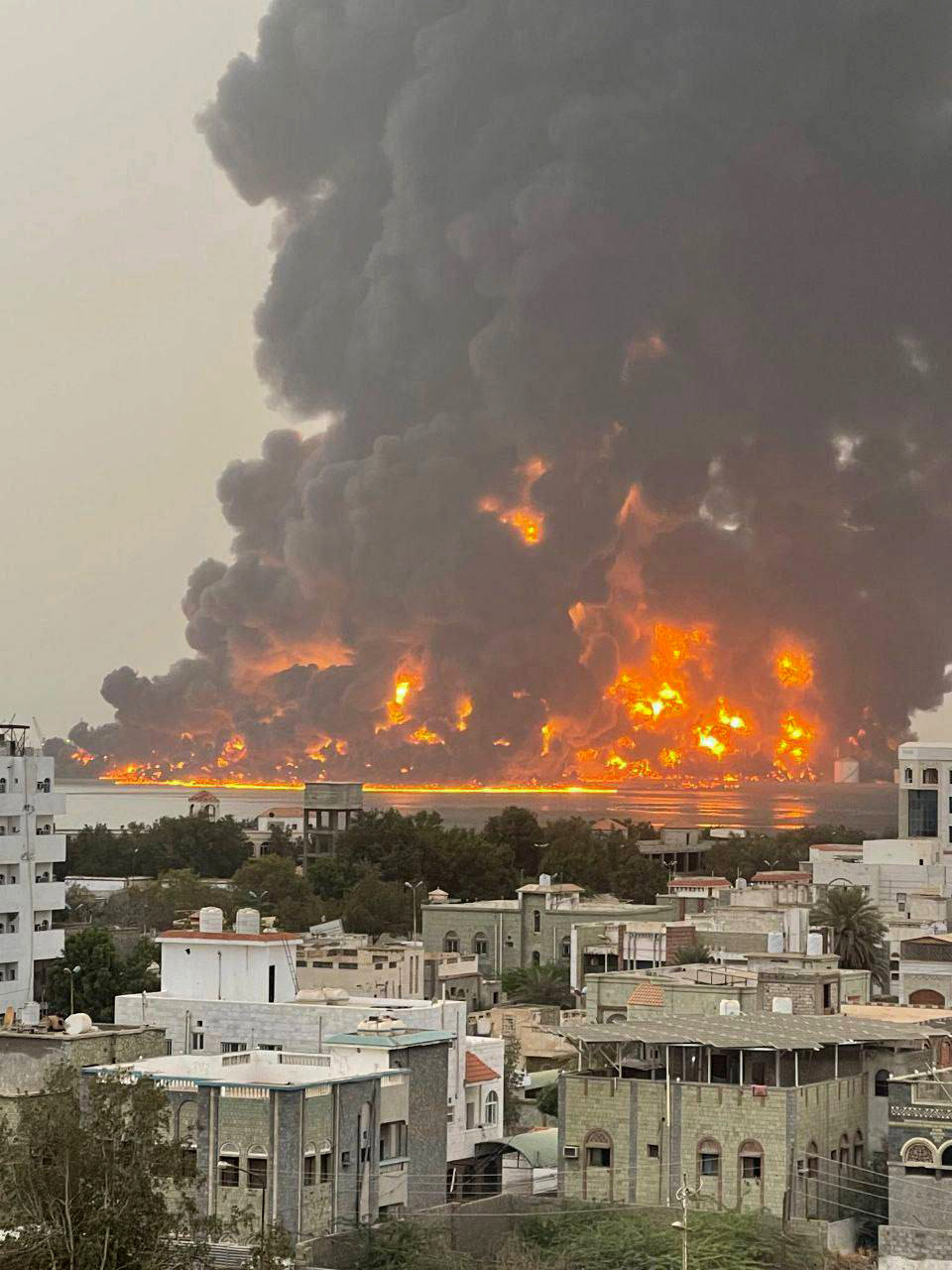 240721 -- HODEIDAH, July 21, 2024 -- This photo taken on July 20, 2024 with a mobile phone shows burning oil storage facilities in Hodeidah, Yemen. Israel s military confirmed Saturday that it bombed sites affiliated with the Houthi militia in Yemen, a day after the military group s explosive drone killed a man in Israel s Tel Aviv. The Yemeni Houthi military group claimed that the strike targeted oil storage and electric facilities in Yemen s Red Sea port city of Hodeidah, and several people were either killed or injured, the group s al-Masirah TV reported in a correction story. SpotNewsYEMEN-HODEIDAH-ISRAEL-AIRSTRIKES XinxHua PUBLICATIONxNOTxINxCHN