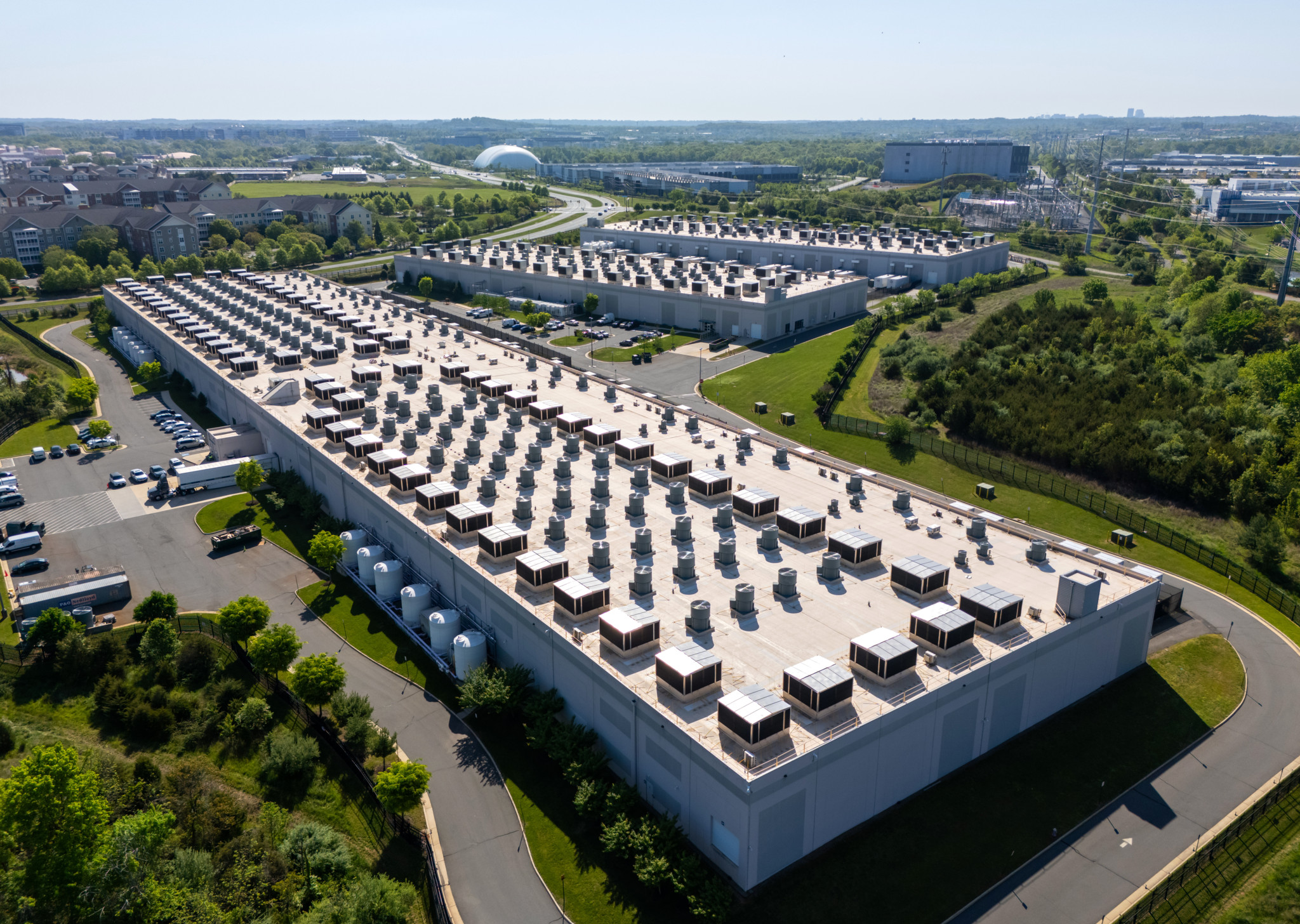 epa11308808 An image made with a drone shows an Amazon data center in Ashburn, Virginia, USA, 29 April 2024. Amazon Web Services (AWS) plans to invest an additional 35 billion USD on data centers in Virginia, according to Virginia Governor Glenn Youngkin. The cluster of data centers in Northern Virginia is the largest in the world, with 70 percent of global internet traffic moving through the state, according to a 2023 report from Amazon.  EPA/JIM LO SCALZO