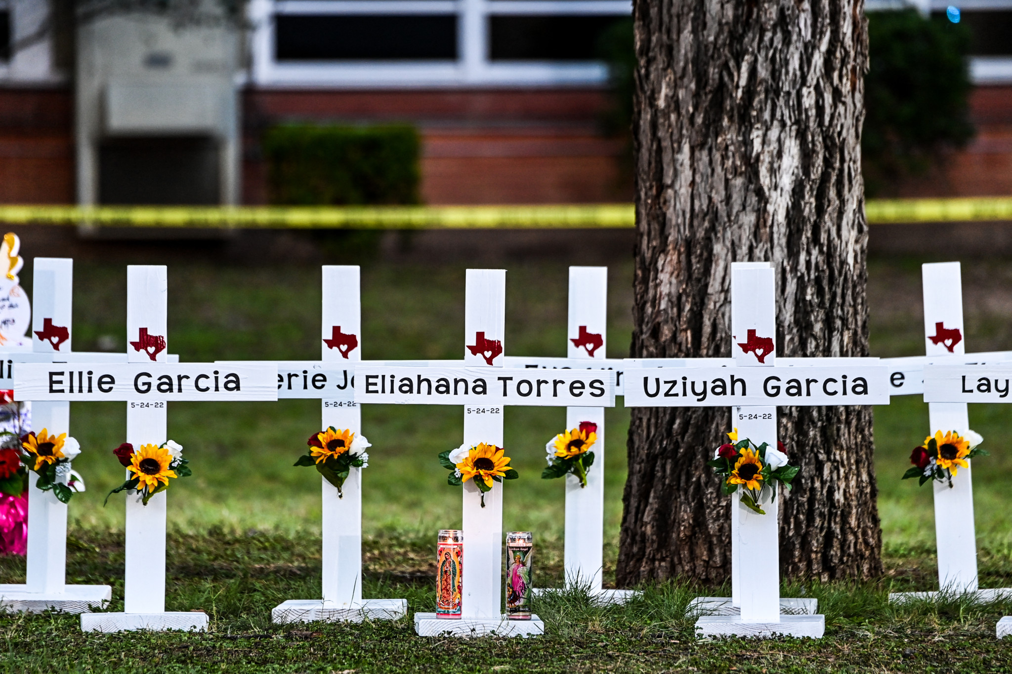 (FILES) Crosses adorn a makeshift memorial for the shooting victims at Robb Elementary School in Uvalde, Texas, on May 26, 2022. US Surgeon General Vivek Murthy on June 25, 2024, issued a landmark advisory declaring gun violence a "public health crisis" and calling for wide-ranging firearm controls that have historically met stiff political opposition. The advisory is the first such major report on gun violence from a surgeon general, whose office has limited authority but plays a significant role in public health issues. (Photo by CHANDAN KHANNA / AFP)