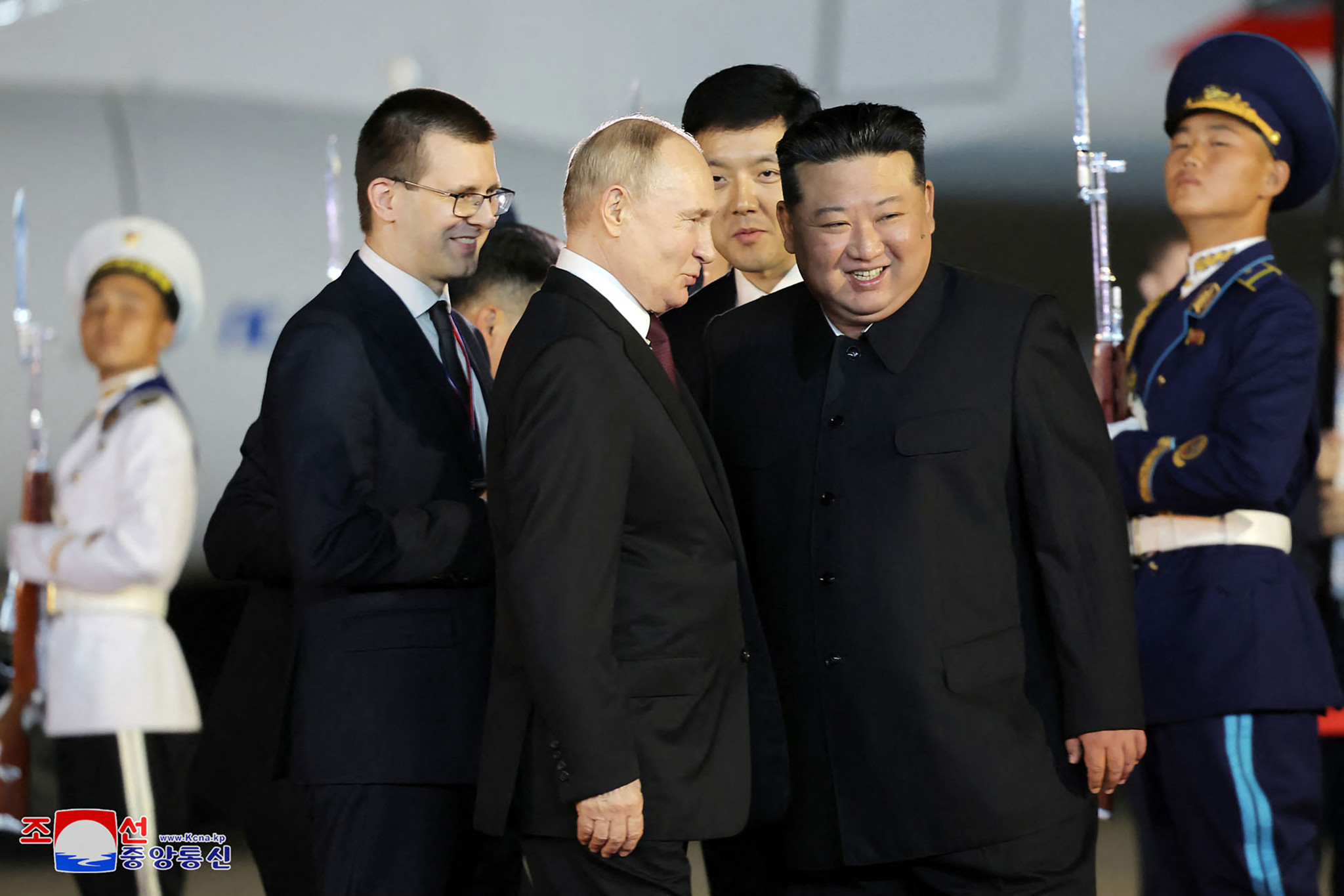 This picture taken early on June 19, 2024 and released from North Korea's official Korean Central News Agency (KCNA) via KNS shows North Korea's leader Kim Jong Un (centre R) welcoming Russia's President Vladimir Putin (centre L) upon his arrival at Pyongyang International Airport in the North Korean capital. (Photo by KCNA VIA KNS / AFP) / South Korea OUT / REPUBLIC OF KOREA OUT
---EDITORS NOTE--- RESTRICTED TO EDITORIAL USE - MANDATORY CREDIT "AFP PHOTO/KCNA VIA KNS" - NO MARKETING NO ADVERTISING CAMPAIGNS - DISTRIBUTED AS A SERVICE TO CLIENTS / THIS PICTURE WAS MADE AVAILABLE BY A THIRD PARTY.  --- / 