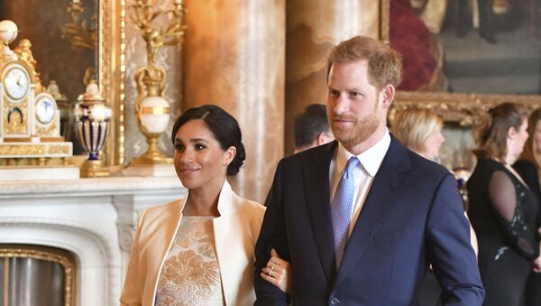 Britain's Prince Harry and Meghan, Duchess of Sussex attend a reception at Buckingham Palace, London, Tuesday March 5, 2019, to mark the fiftieth anniversary of the investiture of the Prince of Wales - Sputnik International