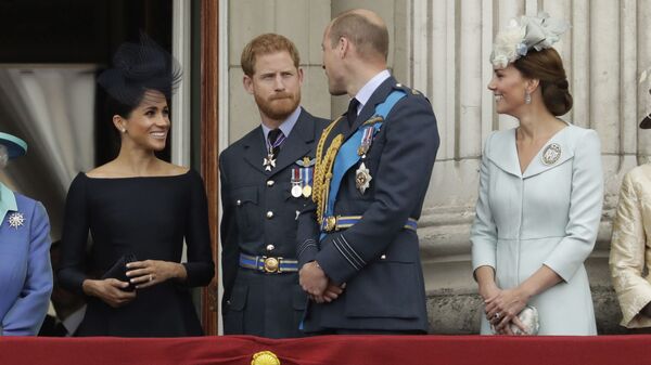 Meghan the Duchess of Sussex, left, Prince Harry, second left, Prince William and Kate the Duchess of Cambridge watch a flypast of Royal Air Force aircraft pass over Buckingham Palace in London, Tuesday, July 10, 2018 - Sputnik International