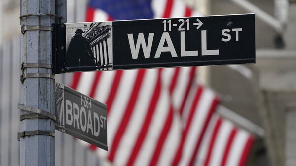 In this Nov. 23, 2020, photo, a street sign is displayed at the New York Stock Exchange in New York. S&P DJ Indices is removing 21 Chinese companies from its indexes, or groups of stocks and bonds used to track financial market movements, after Americans were barred from investing in them as part of a feud with Beijing over technology and security. - Sputnik International