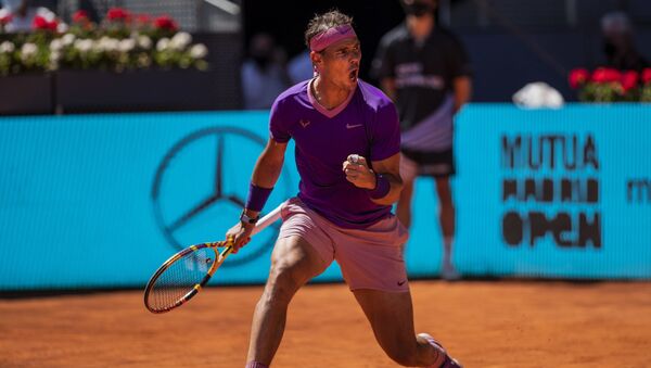 Spain's Rafael Nadal celebrates a point against Germany's Alexander Zverev during their match at the Mutua Madrid Open tennis tournament in Madrid, Spain, Friday, May 7, 2021 - Sputnik International