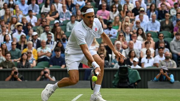 Switzerland's Roger Federer returns against Poland's Hubert Hurkacz during their men's quarter-finals match on the ninth day of the 2021 Wimbledon Championships at The All England Tennis Club in Wimbledon, southwest London, on July 7, 2021.  - Sputnik International