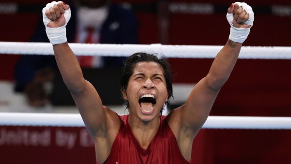 Tokyo 2020 Olympics - Boxing - Women's Welterweight - Quarterfinal - Kokugikan Arena - Tokyo, Japan - July 30, 2021. Lovlina Borgohain of India celebrates after the fight against Chen Nien-Chin of Taiwan. - Sputnik International