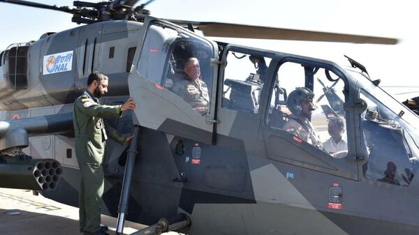 General Bipin Rawat  in Light Combat Helicopter at the AeroIndia 2019  - Sputnik International