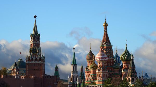 A general view shows the St. Basil's Cathedral and the Kremlin's Spasskaya Tower on a sunny autumn day, in Moscow, Russia. - Sputnik International