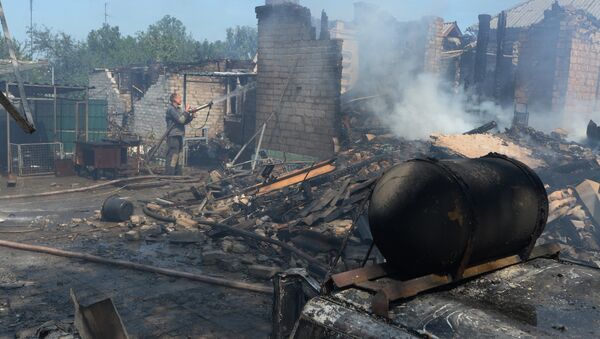 Private houses destroyed during an artillery attack by the Ukrainian army - Sputnik International