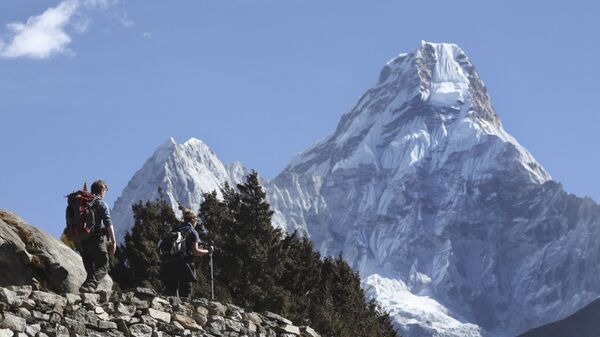 In this Feb. 19, 2016, file photo, trekkers make their way to Dingboche, a popular Mount Everest base camp, in Pangboche, Nepal. - Sputnik International