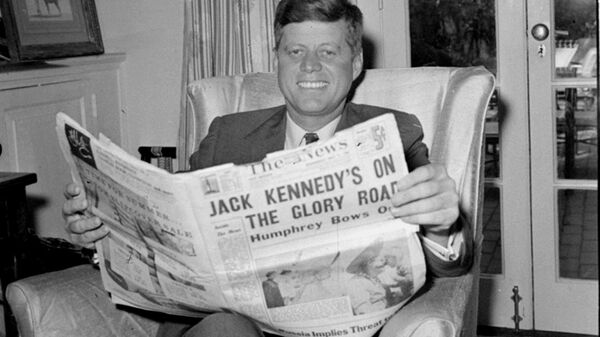 Sen. John F. Kennedy (D-MA) reads the daily newspaper accounts of his West Virginia election victory as he relaxes, May 11, 1960, in his Washington home. Kennedy defeated Sen. Hubert Humphrey (D-MN) in yesterday's presidential primary.  - Sputnik International