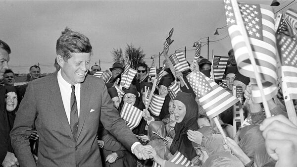 U.S. President John F. Kennedy is greeted by an enthusiastic crowd of children and nuns from the Convent of Mercy, as he arrives from Dublin by helicopter at Galway's sports ground, Ireland, June 29, 1963.  - Sputnik International