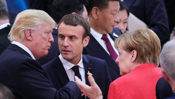 German Chancellor Angela Merkel and US President Donald Trump exchange pleasantries during the G20 summit in Hamburg, 2018. - Sputnik International