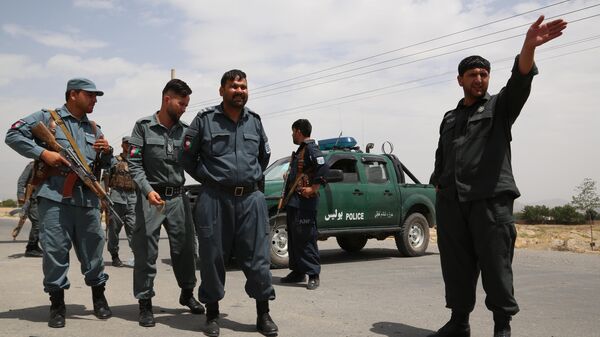 Сотрудники национальной полиции Афганистана на контрольно-пропускном пункте в Кабуле