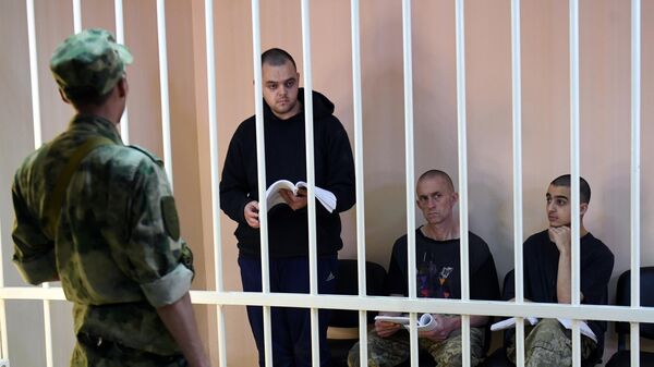 Граждане Великобритании Эйден Эслин, Шон Пиннер, обвиняемые в участии в качестве наемников в боевых действиях на территории ДНР