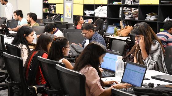  young men and women working in a co-working space in Delhi, India