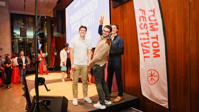 Students Vasko Georgiev, Bennett Slosman, and William Johnston celebrate their audience-favorite win at the Tom Tom Festival's Crowdfunded Pitch Night (photo by Alisa Foytik)