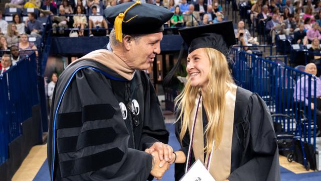 Professor and student at Commencement