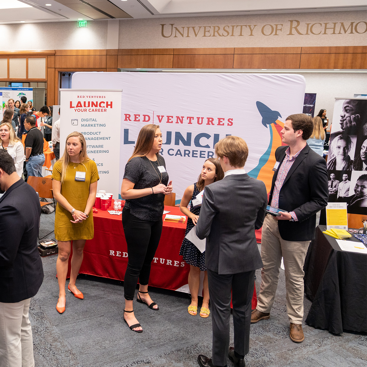 Employers talking to students at Career Fair