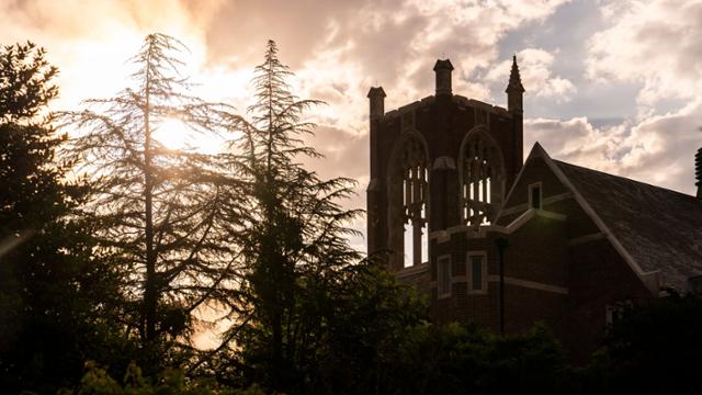 Sun rising over tower