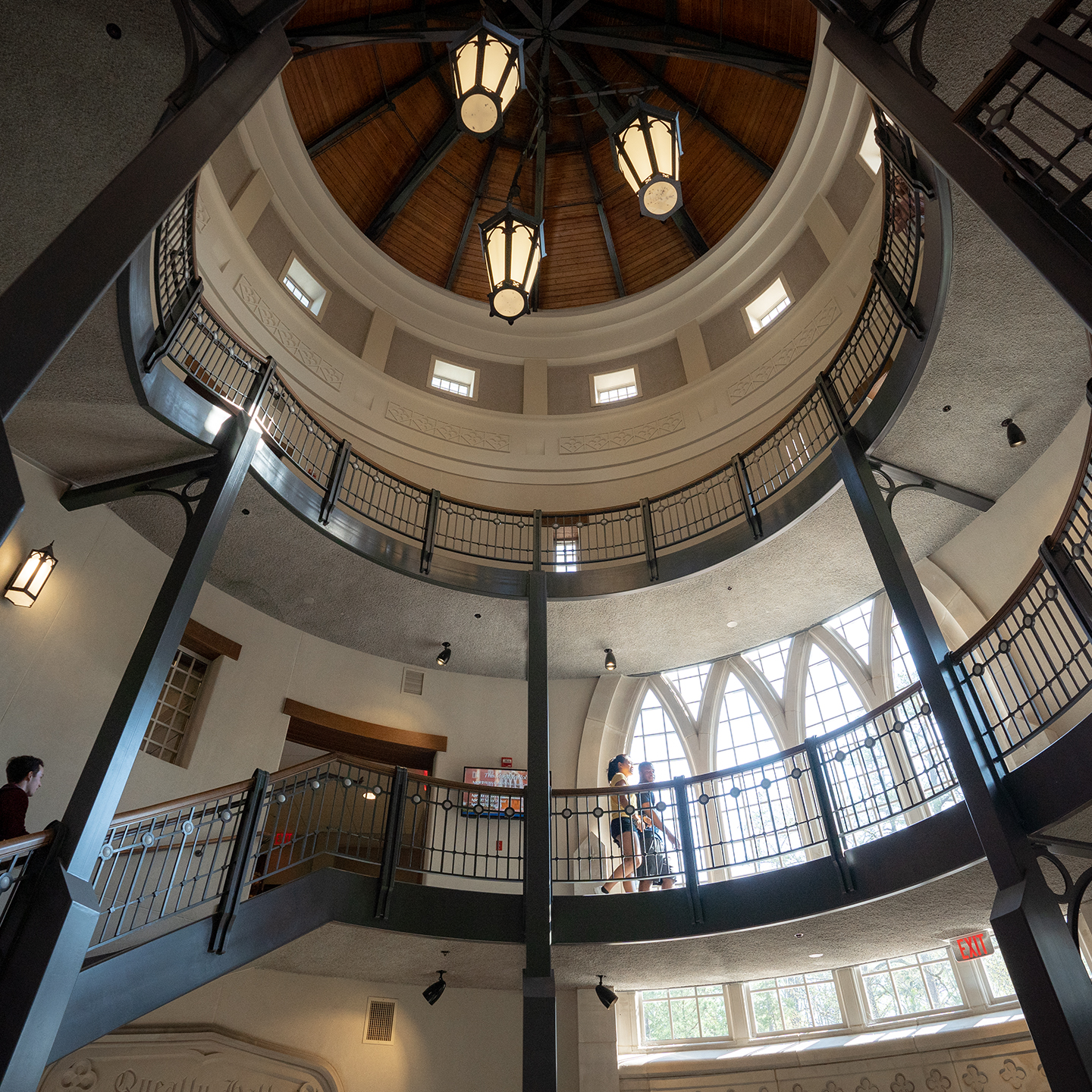 Students walking up the staircase inside Queally Tower.