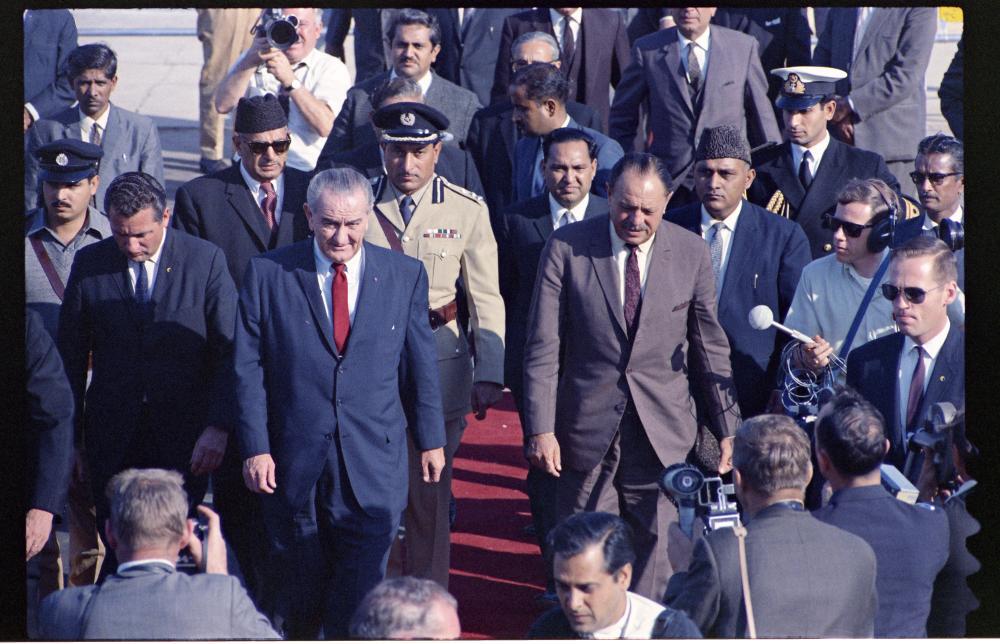 President Lyndon B. Johnson walking with President Mohammad Ayub Khan of Pakistan