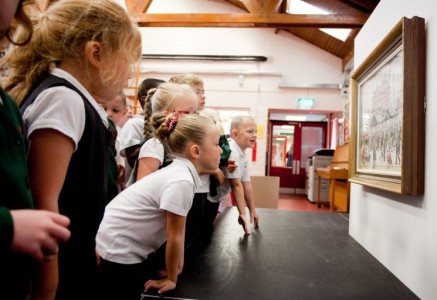 Pupils from St Matthew's Primary School in Stretford examining a work by L. S. Lowry during our Masterpieces in Schools project in 2013