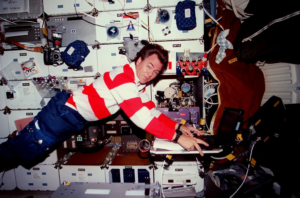 Bjarni Tryggvason inputting data into a computer for the Microgravity Vibration Isolation Mount (MIM) experiment, August 1997.