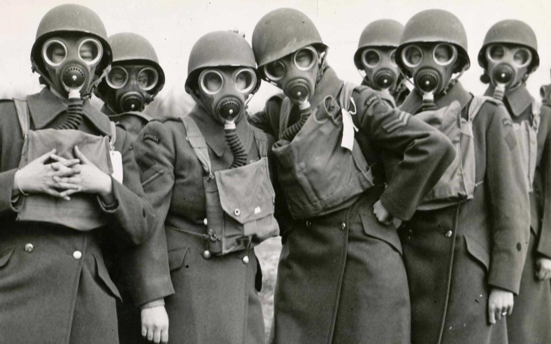 Aileen Hanger with additional members of CWAC, on a break during gas mask training.