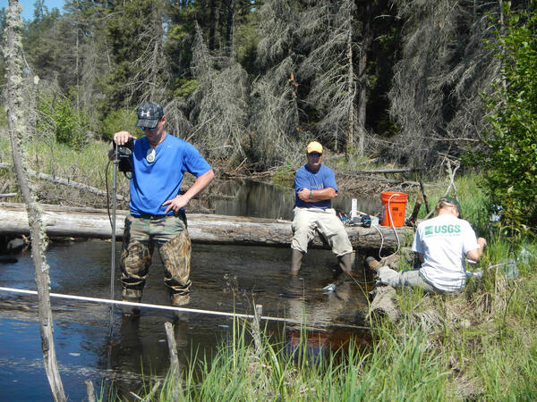 scientists sampling water