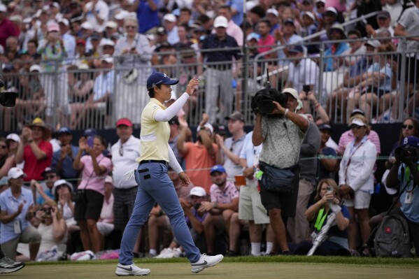 Yuka Saso, of Japan, waves to the crowd after winning the U.S. Women's Open golf tournament at Lancaster Country Club, Sunday, June 2, 2024, in Lancaster, Pa. (AP Photo/Matt Slocum)