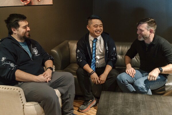 Jam & Tea Studios founders, left to right, Michael Yichao, Carl Kwoh, and J. Aaron Farr sit for photos on Jan. 18, 2024, in Roslyn, Wash. (Lutisha Aubrey Photography via AP)