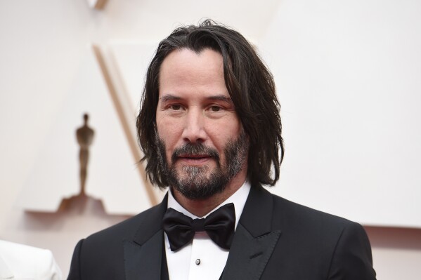 FILE - Keanu Reeves appears at the Oscars in Los Angeles on Feb. 9, 2020. Reeves and Alex Winter, who starred in the “Bill & Ted” film franchise, are reuniting on Broadway for a revival of the brainy, existential classic “Waiting for Godot.” The play is planned for the fall of 2025. (Photo by Jordan Strauss/Invision/AP, File)