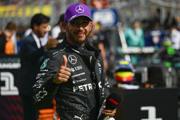 Mercedes driver Lewis Hamilton of Britain celebrates his third place at the Hungarian Formula One Grand Prix race at the Hungaroring racetrack in Mogyorod, Hungary, Sunday, July 21, 2024. (AP Photo/Denes Erdos)
