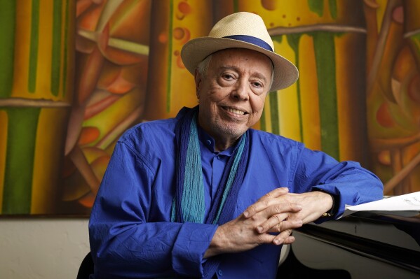 FILE - Brazilian musician Sergio Mendes sits for a portrait at home in Los Angeles, May 18, 2021. (AP Photo/Chris Pizzello, File)