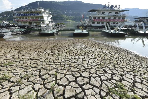 Piers are seen near the dried riverbed exposed after the water level dropped in the Yangtze River in Yunyang county in southwest China's Chongqing Municipality Tuesday, Aug. 16, 2022. Unusually high temperatures and a prolonged drought are affecting large swaths of China, reducing crop yields and drinking water supplies. (Chinatopix Via AP) CHINA OUT