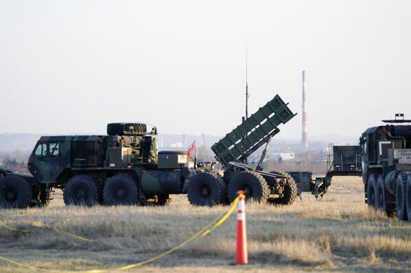 FILE - Patriot missiles are seen at the Rzeszow-Jasionka Airport, March 25, 2022, in Jasionka, Poland. The U.S. will send $1.8 billion in military aid to Ukraine in a massive package that will for the first time include a Patriot missile battery and precision guided bombs for their fighter jets, U.S. officials said Tuesday, Dec. 20, 2022, as the Biden administration prepares to welcome Ukrainian President Volodymyr Zelenskyy to Washington. (AP Photo/Evan Vucci, File)