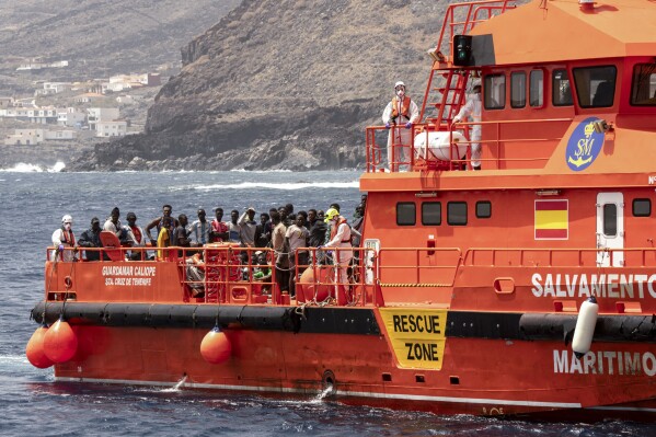 Migrants disembark at the port of on "La Estaca" in Valverde at the Canary island of El Hierro, Spain, Monday, Aug. 26, 2024. Migrants arrived by boat after a thirteen-day voyage from the coast of Senegal. (AP Photo/Maria Ximena)