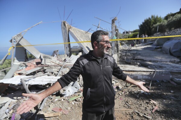 A Lebanese man gestures as he inspects a destroyed house that was hit on Friday night by an Israeli airstrike, killing one woman and wounding several other people, in the southern village of Adloun, Lebanon, Saturday, June 1, 2024. The militant Hezbollah group shot down Saturday an Israeli Hermes 900 Kochav drone over south Lebanon, after hours of Israeli drones strikes that killed at least one person and wounded others. (AP Photo/Mohammad Zaatari)
