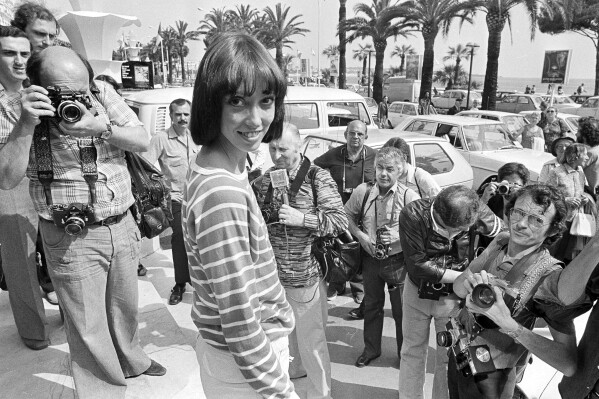 FILE - Shelley Duvall poses for photographers at the 30th Cannes Film Festival in France, May 27, 1977. Duvall, whose wide-eyed, winsome presence was a mainstay in the films of Robert Altman and who co-starred in Stanley Kubrick's “The Shining,” has died. She was 75. (AP Photo/Jean-Jacques Levy, File)