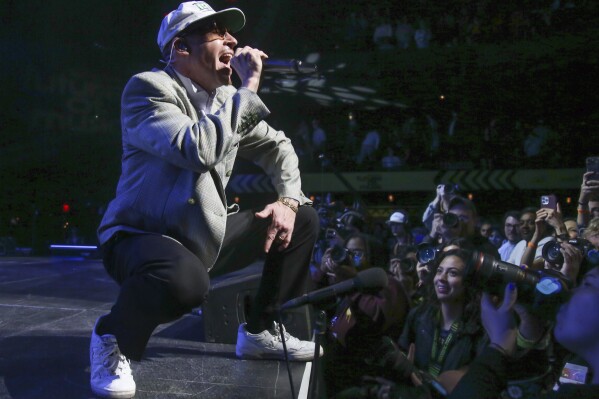 FILE - Macklemore performs at Austin City Limits Live at the Moody Theater during the South by Southwest Music Festival on Friday, March 17, 2023, in Austin, Texas. American rapper Macklemore said Saturday, Aug. 24, 2024, he canceled an upcoming October concert in Dubai over the United Arab Emirates' "role ... in the ongoing genocide and humanitarian crisis" stemming from the war gripping Sudan through its reported support of the paramilitary Rapid Support Forces there. (Photo by Jack Plunkett/Invision/AP, File)