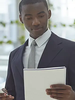 man reviews a document