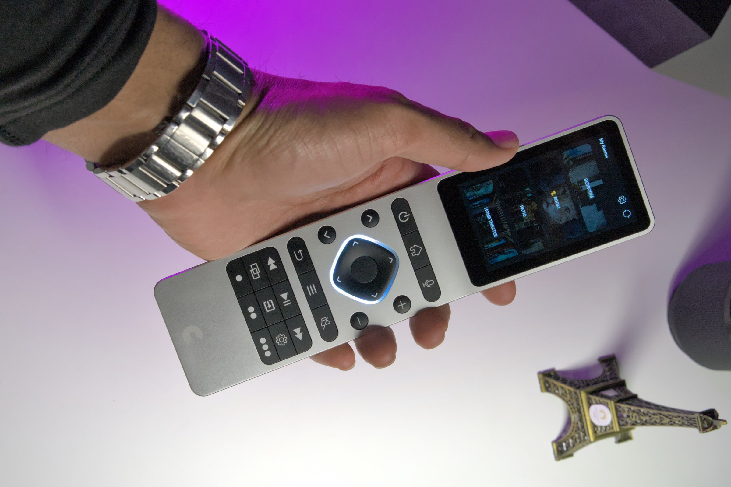 Someone holding Haptique RS90 remote